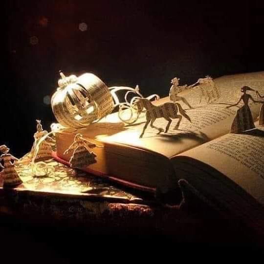 Decorative image of fairytale characters such as unicorns and a princess made from the pages of a book.